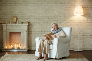 senior woman sitting in a white recliner